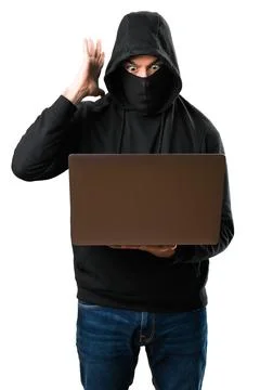Hacker with his computer making surprise gesture on isolated white background 스톡 사진