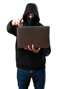 Hacker with his computer pointing to the front on isolated white background Stock Photos