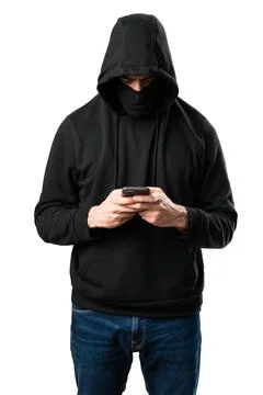 Hacker with his mobile on isolated white background 写真素材