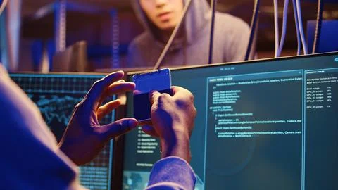 Hacker holding SSD with computer exploit Stock Photos