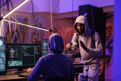 Hacker holding ssd with illegal malware Stock Photos