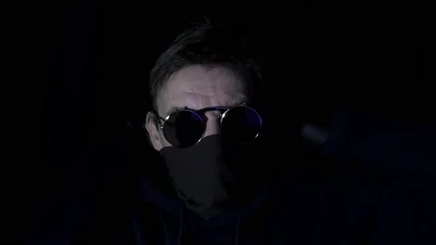 Hacker in a hood and round glasses. Stock Footage 169009268