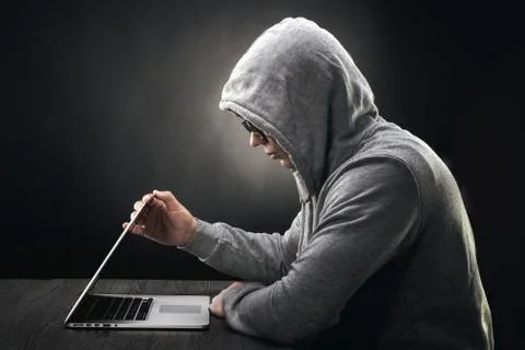Hacker in a hood Stock Photos