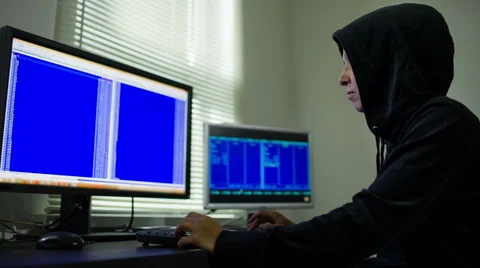 Hacker in hood stealing information Stockbeeldmateriaal 52883999