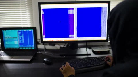 Hacker in hood stealing information Stockbeeldmateriaal 52885907