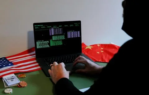 Hacker in Hoodie Running Terminals Command Station Stock Photos