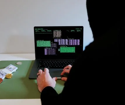 Hacker in Hoodie Running Terminals Command Station 스톡 사진