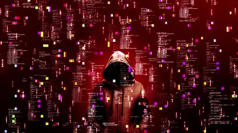 Hacker in a Hoodie Using a Laptop in a Digital Red futuristic red background cod Stock Footage 341896162