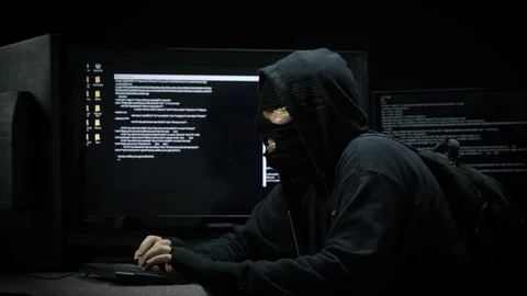 Hacker Infiltrating Computer for Code Information Stock Footage 115834684