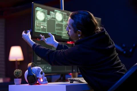 Hacker inserting USB stick with exploits on computer to break into systems Stock Photos