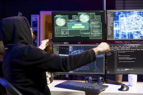 Hacker inserting USB stick in PC with malware used to get access granted Stock Photos