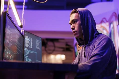Hacker installing spyware on computer 스톡 사진