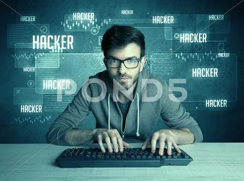 Hacker with keyboard and glasses Stock Photos