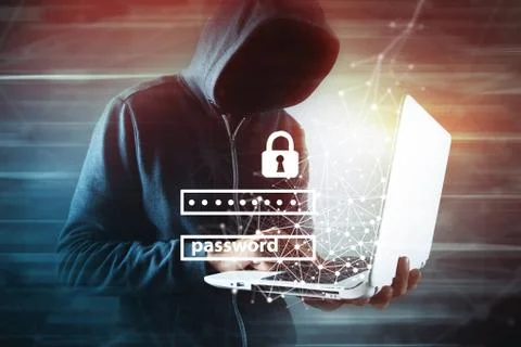 Hacker with laptop. Computer crime. Stock Photos