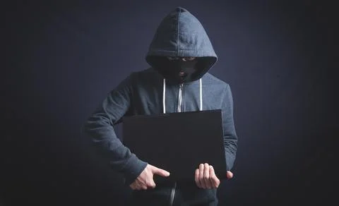 Hacker with laptop. Computer crime Stock Photos