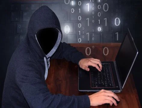 Hacker with laptop Stock Photos