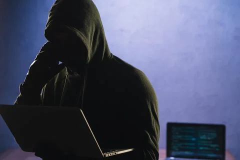 Hacker with laptop Stock Photos