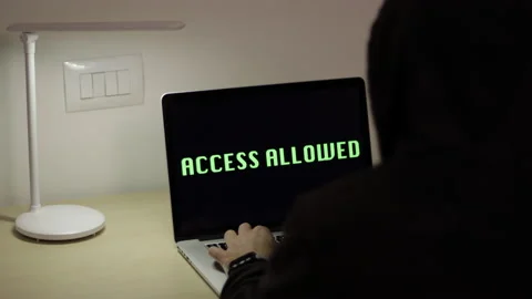 Hacker on laptop, security on internet. Green Display, Access allowed message Stock Footage 149777023