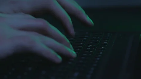 Hacker with laptop typing 3 Stock Footage 102848575