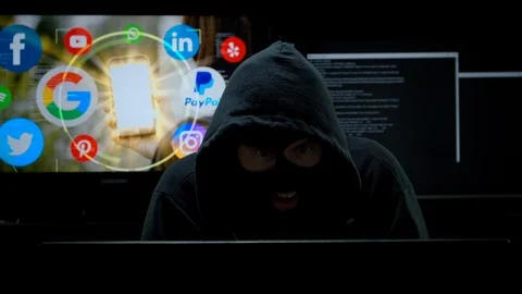 Hacker Laughing as he steals your Private Social Media Data Stock Footage 115834777