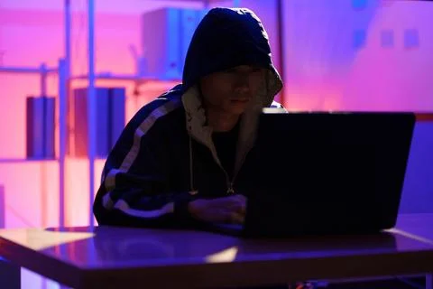 Hacker launching cyberattack targeting data systems and exposing cybersecurit Stock Photos