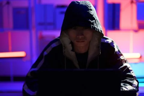Hacker launching cyberattack targeting data systems and exposing cybersecurit Stock Photos