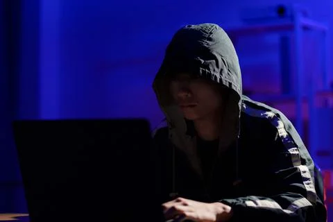 Hacker launching cyberattack targeting data systems and exposing cybersecurit Stock Photos