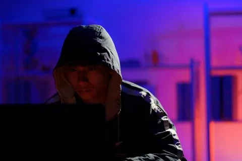 Hacker launching cyberattack targeting data systems and exposing cybersecurit Stock Photos