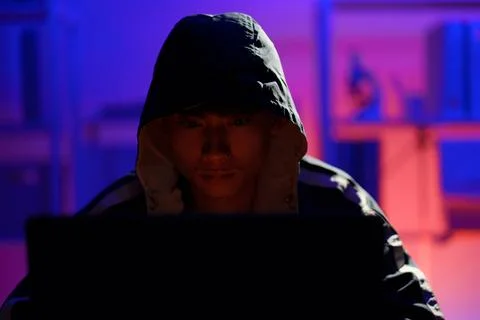 Hacker launching cyberattack targeting data systems and exposing cybersecurit Stock Photos