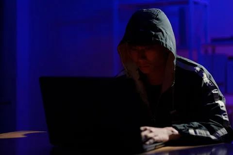 Hacker launching cyberattack targeting data systems and exposing cybersecurit Stock Photos