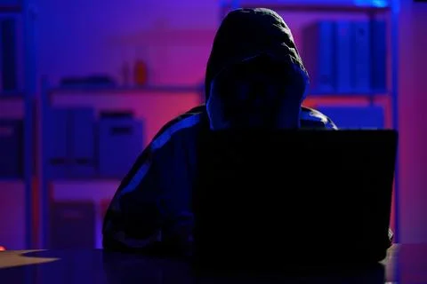 Hacker launching cyberattack targeting data systems and exposing cybersecurit Stock Photos