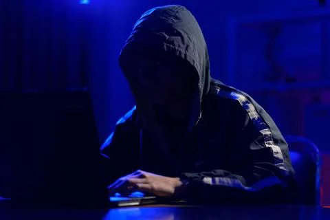 Hacker launching cyberattack targeting data systems and exposing cybersecurit Stock Photos