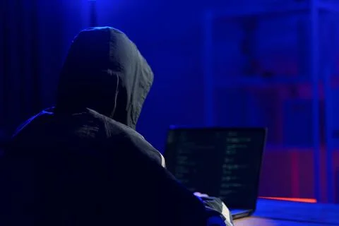 Hacker launching cyberattack targeting data systems and exposing cybersecurit Stock Photos