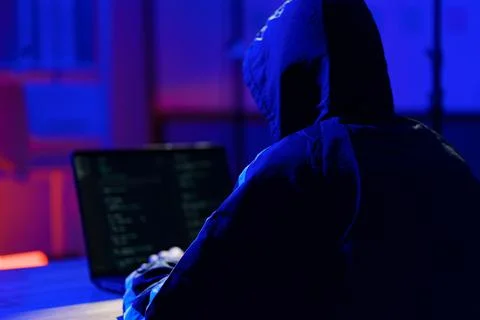 Hacker launching cyberattack targeting data systems and exposing cybersecurit Stock Photos