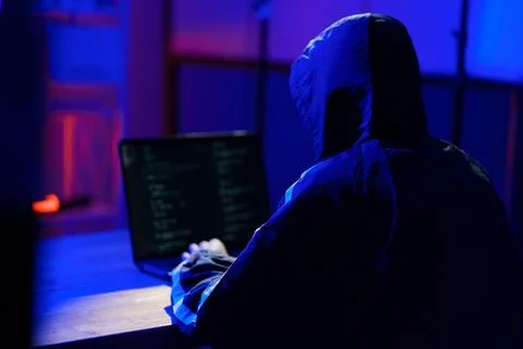 Hacker launching cyberattack targeting data systems and exposing cybersecurit Stock Photos