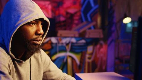 Hacker launching DDoS attack Stock Photos