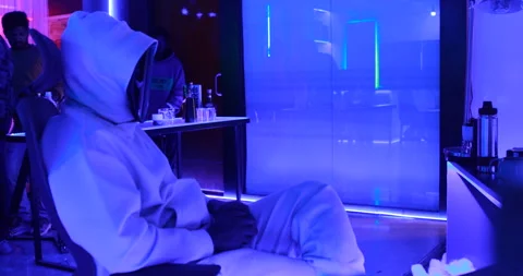 Hacker with LED Mask Working On Computers Stock Footage 260447992