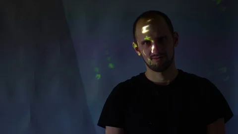 Hacker looking in camera with binary codes from monitor 库存影片 99735704