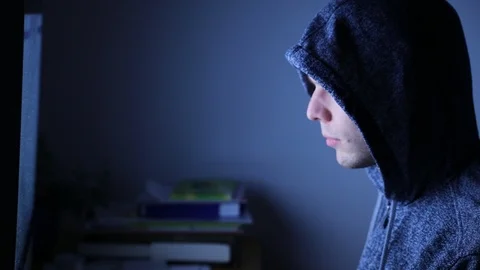 Hacker looking at computer screen by night, internet fraud Stock Footage 98093577