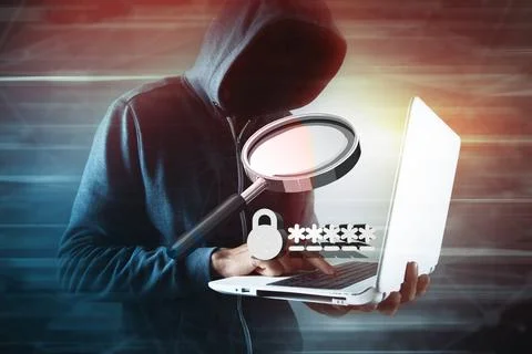 Hacker looking to hack data. Stock Photos