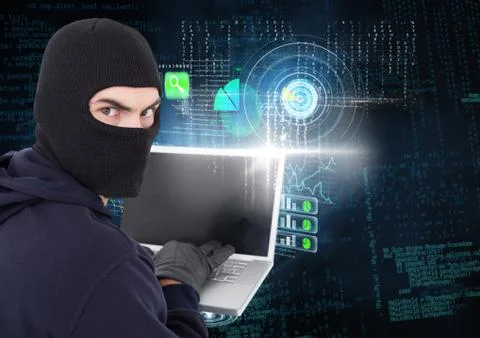 Hacker looking the lens and using a laptop in front of digital background 写真素材