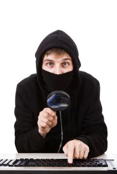 Hacker with a Magnifying Glass Stock Photos
