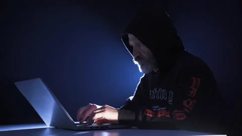 Hacker male commit crime from laptop by cracking password. Stock Footage 227563761