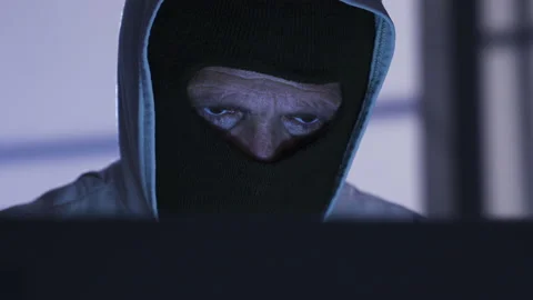Hacker male commits crime by cracking password from laptop. Illegal. Video stock 227566530