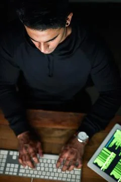 Hacker, man and computer keyboard in night programming, coding software or Stock Photos