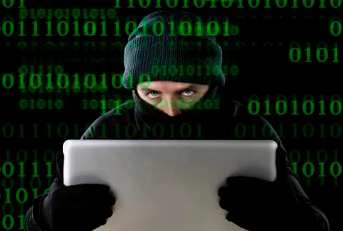 Hacker man hacking computer laptop for criminal activity password break Stock Photos