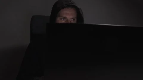 Hacker, man with laptop, dangerous guy, violent actions, criminal network. Stock Footage 277439247