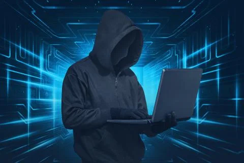 Hacker man with mask using laptop while standing Stock Photos