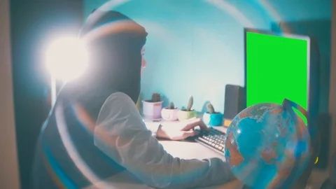 Hacker man programmer in the hood using computer for hack information and data Stock Footage 88296846