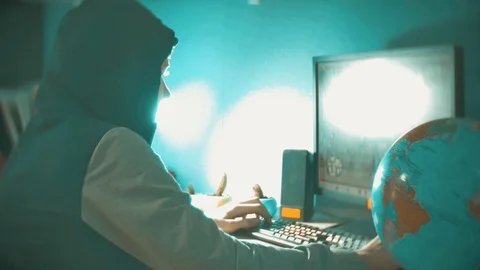 Hacker man programmer in the hood using computer for hack information and data Stock Footage 88327223